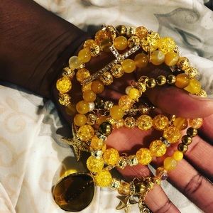 Gold charmed bracelets